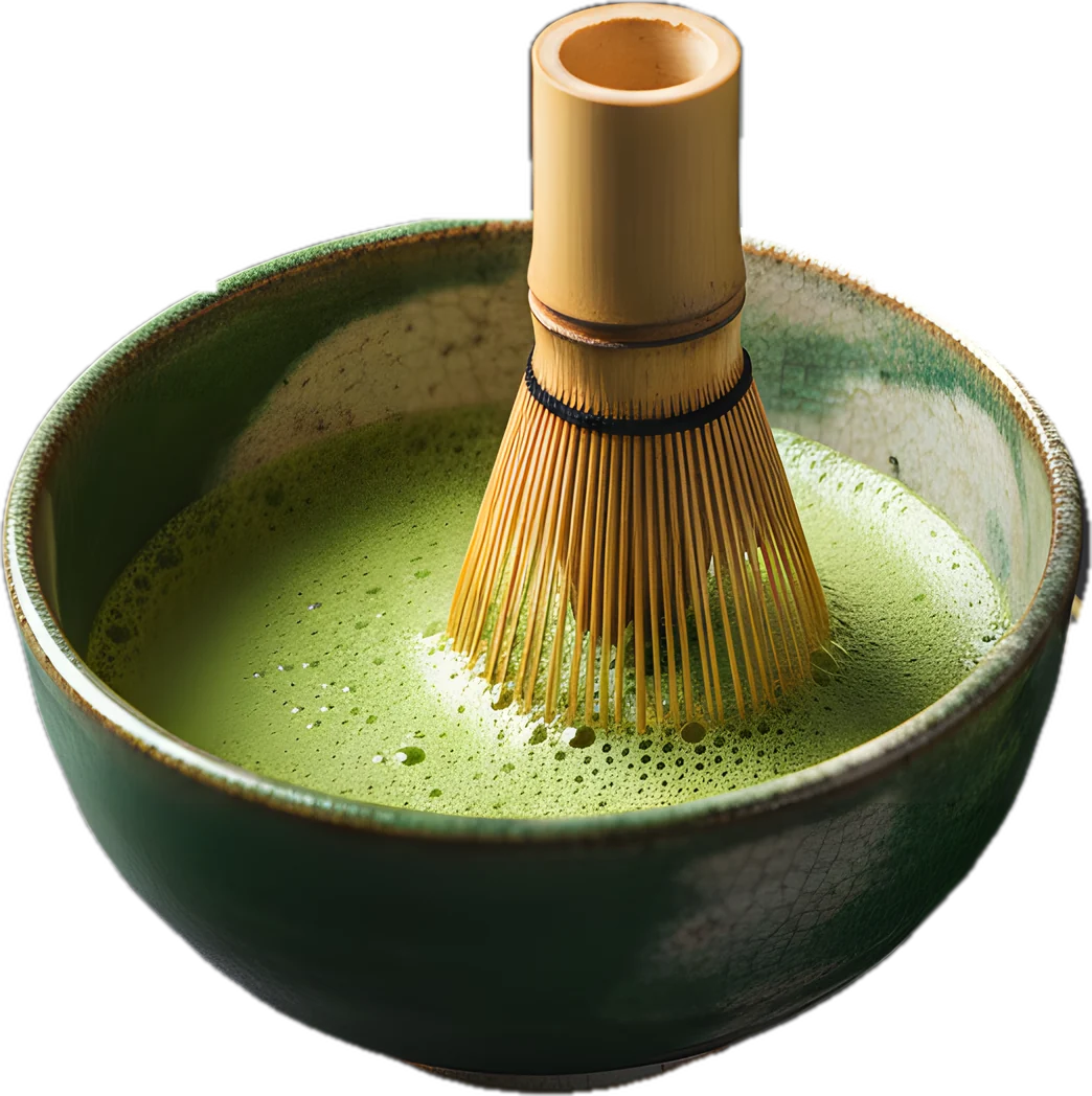 Frisch aufgeschlagener Matcha in der Keramikschale mit Bambusbesen